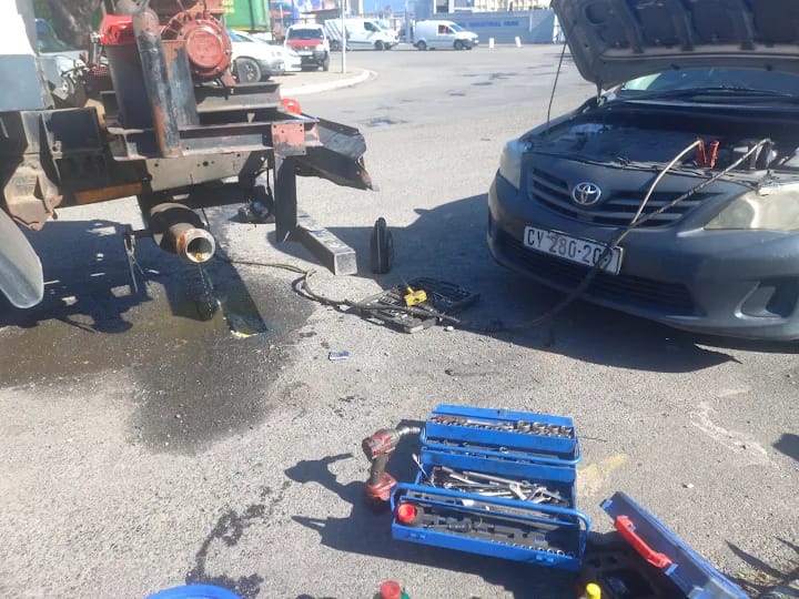 Roadside mechanical assistance with tool boxes laid out